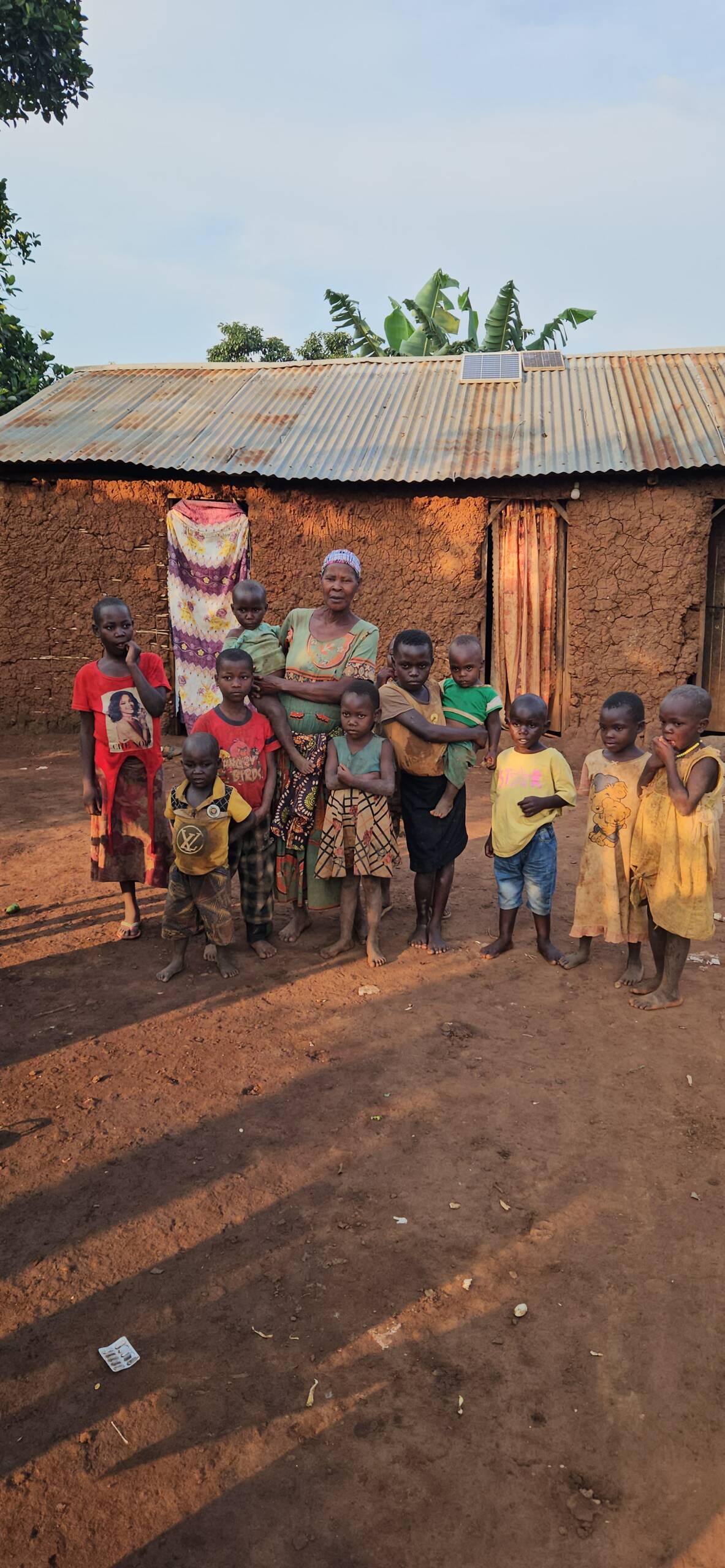An elderly woman is single handedly caring for ten children